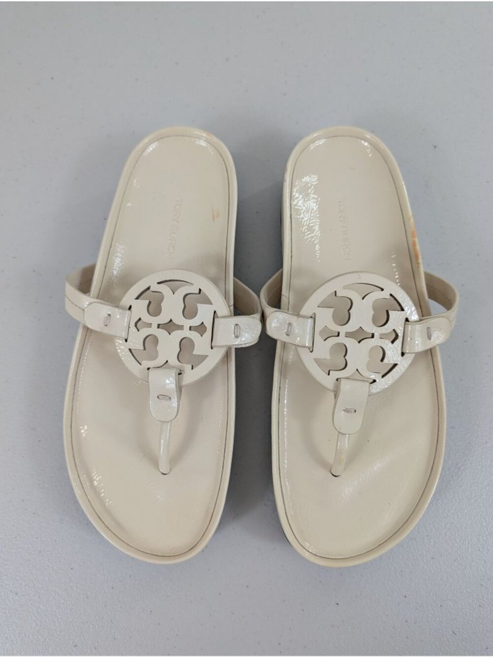 Tory Burch miller cloud lug sandals featuring a cream-colored leather size 8.5M